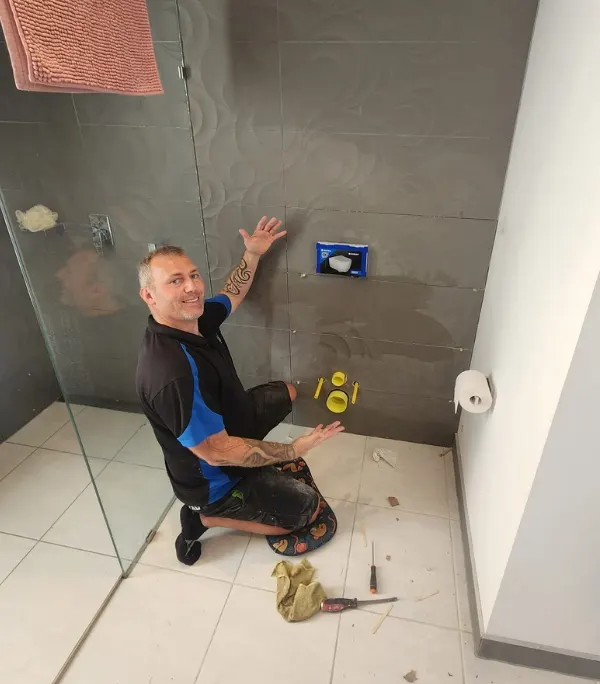 Nick setting out a shower rough-in on a Gold Coast bathroom renovation