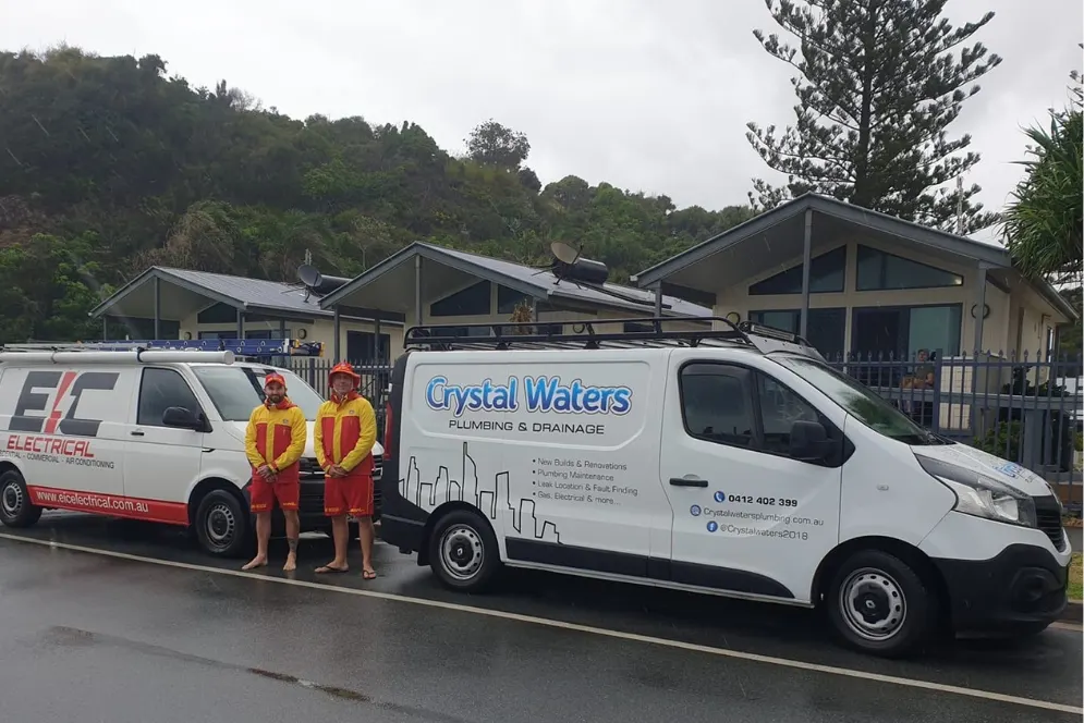 The Crystal Waters Plumbing team and vans on a Gold Coast job